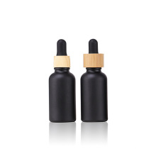 1oz 30ml matte black cosmetic serum essential oil glass dropper bottle with bamboo lid